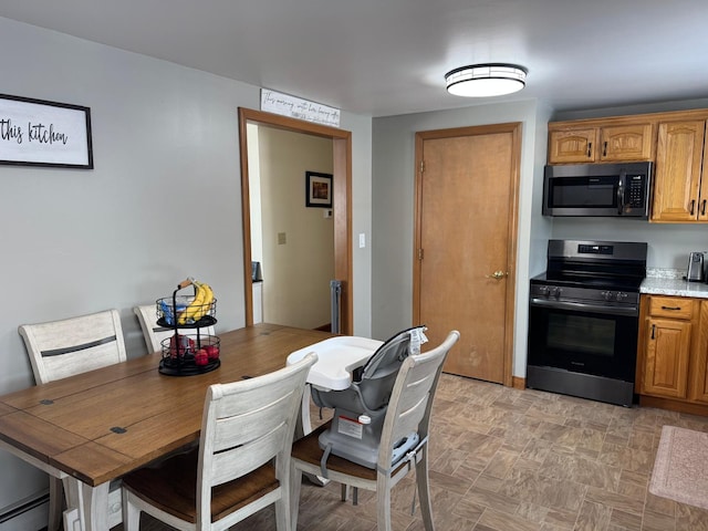 dining area with a baseboard radiator