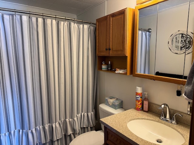 full bathroom with vanity, curtained shower, and toilet