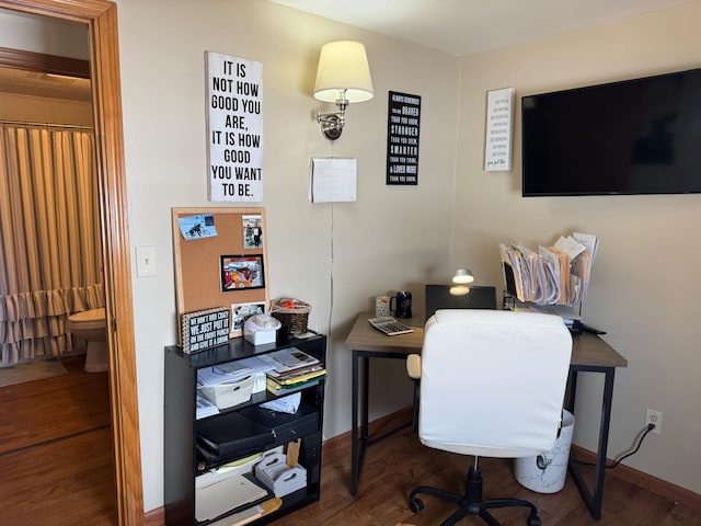 office area featuring wood finished floors and baseboards