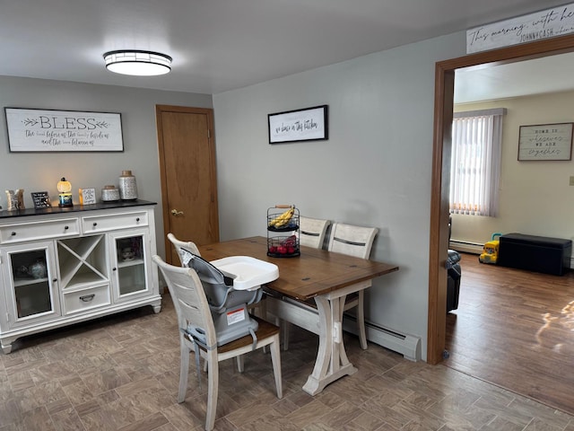 dining area with a baseboard radiator