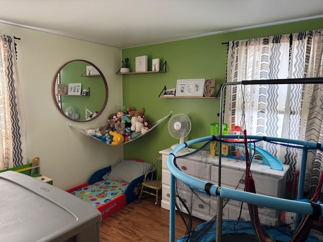 bedroom with wood finished floors