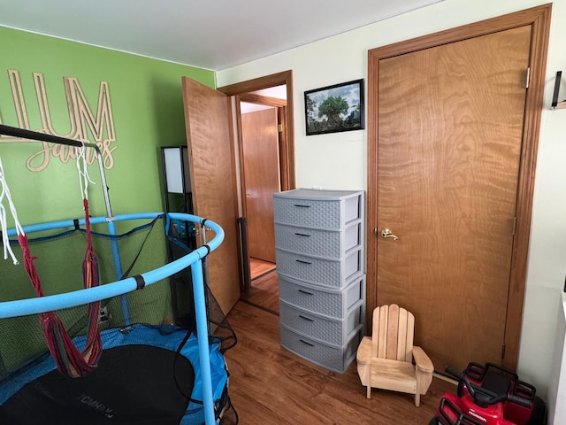 bedroom with wood finished floors