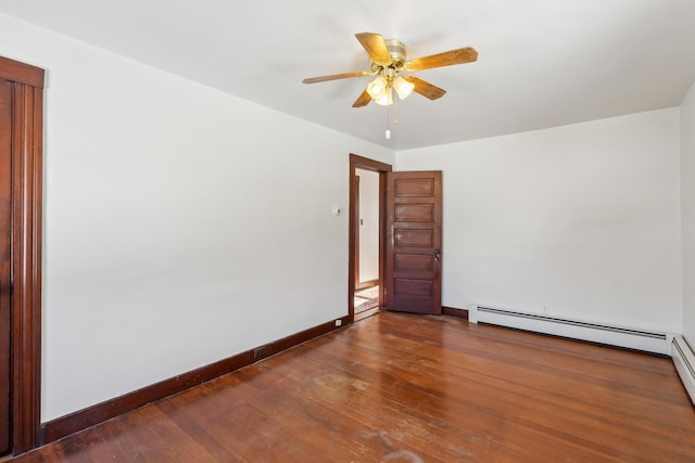 empty room with wood-type flooring, baseboards, baseboard heating, and ceiling fan