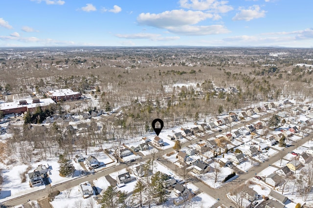 snowy aerial view featuring a residential view