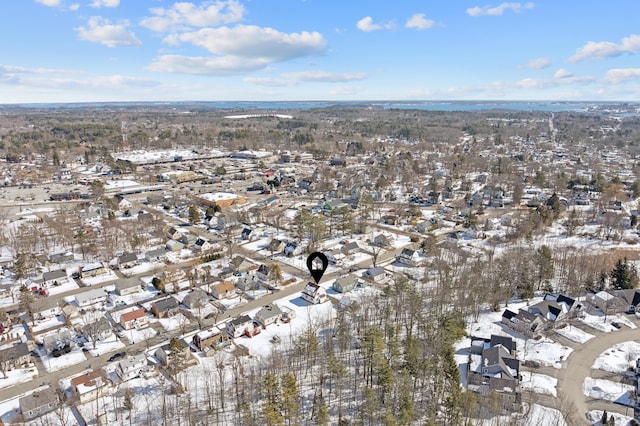 snowy aerial view featuring a residential view