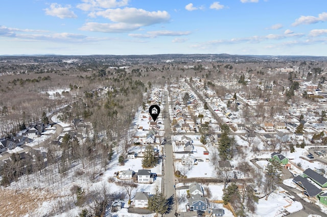 snowy aerial view with a residential view