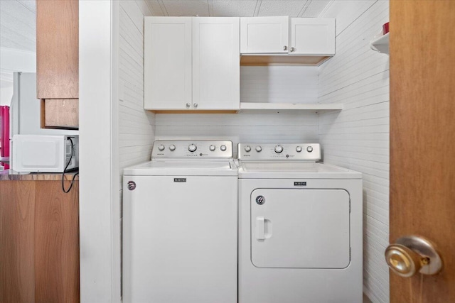 laundry room with separate washer and dryer