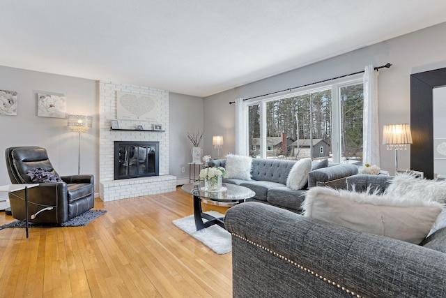 living area featuring a fireplace and hardwood / wood-style flooring