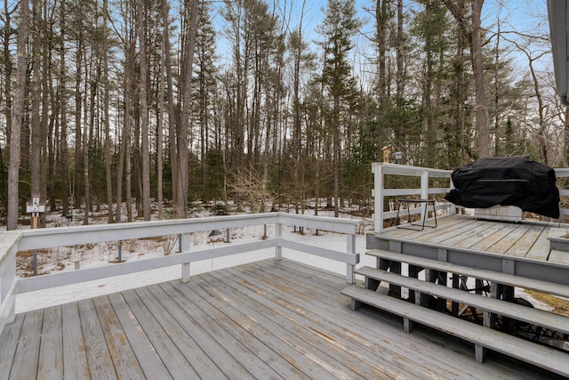 wooden deck with grilling area