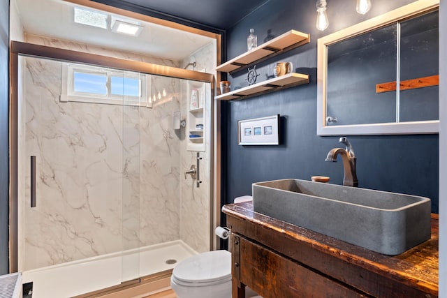 bathroom with a marble finish shower, toilet, and vanity