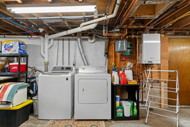 unfinished below grade area featuring washing machine and dryer and water heater