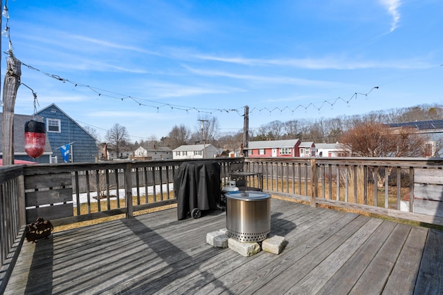 wooden terrace featuring a residential view