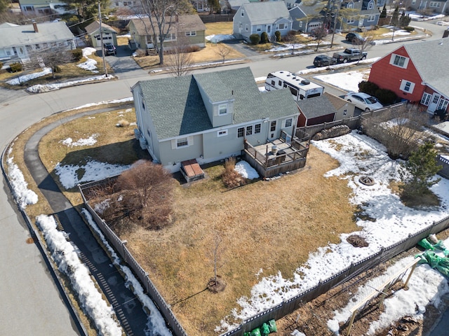 snowy aerial view featuring a residential view