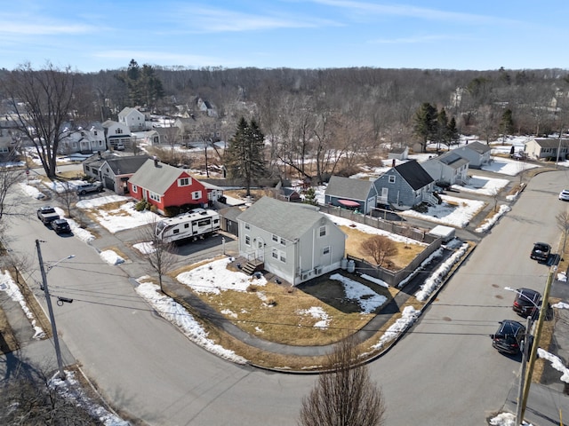 snowy aerial view featuring a residential view