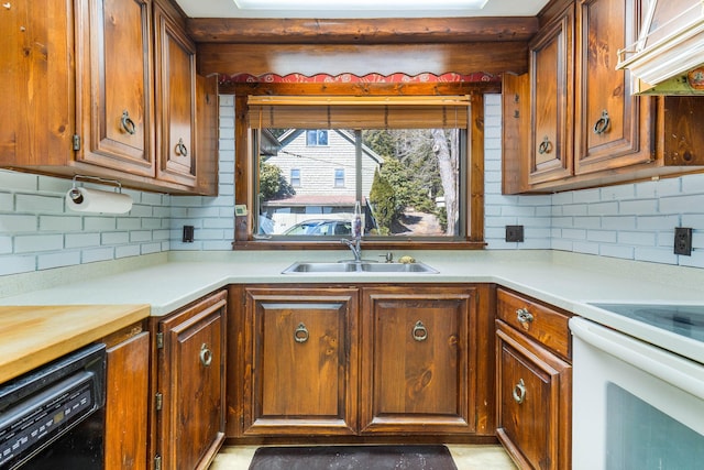 44 Periwinkle Ln, Phippsburg, ME 04562 - kitchen with decorative backsplash, range hood, white electric range, and black dishwasher