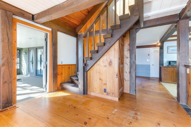 44 Periwinkle Ln, Phippsburg, ME 04562 - stairway with visible vents, wood walls, wood ceiling, beam ceiling, and hardwood / wood-style flooring