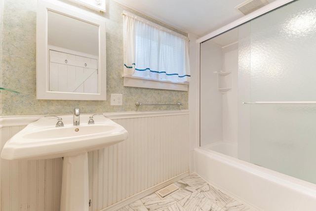 44 Periwinkle Ln, Phippsburg, ME 04562 - full bath with visible vents, bathing tub / shower combination, marble finish floor, and wainscoting
