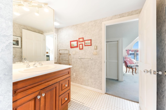 44 Periwinkle Ln, Phippsburg, ME 04562 - bathroom with baseboards, vanity, and tile patterned flooring