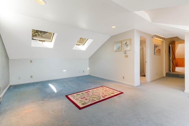 44 Periwinkle Ln, Phippsburg, ME 04562 - bonus room featuring baseboards, lofted ceiling with skylight, and carpet
