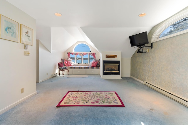 44 Periwinkle Ln, Phippsburg, ME 04562 - rec room featuring baseboard heating, a glass covered fireplace, vaulted ceiling, and carpet