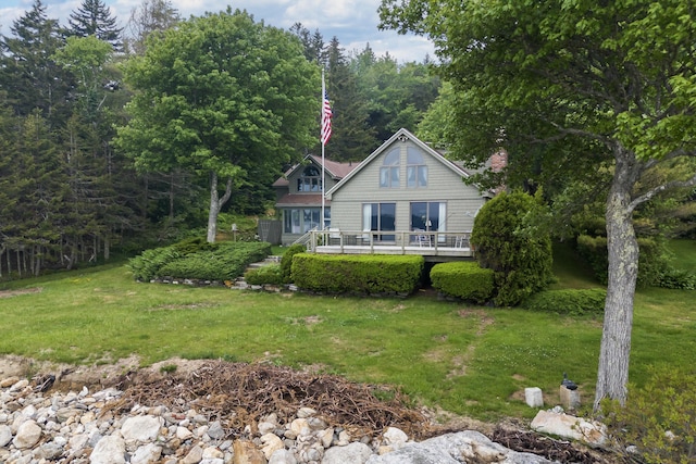 44 Periwinkle Ln, Phippsburg, ME 04562 - back of property with a lawn and a deck