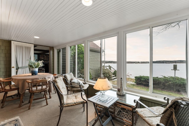 44 Periwinkle Ln, Phippsburg, ME 04562 - sunroom with a water view and carpet floors