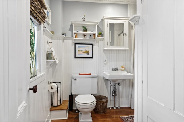 bathroom featuring toilet and wood finished floors