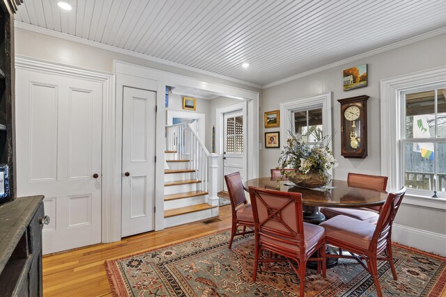 dining area featuring recessed lighting, ornamental molding, stairs, wood ceiling, and light wood-type flooring