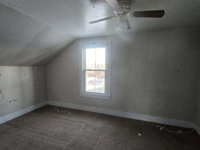 bonus room featuring lofted ceiling, carpet, and baseboards