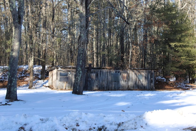 exterior space featuring a forest view