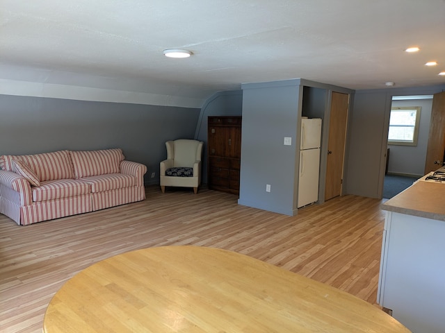 unfurnished living room featuring recessed lighting and light wood-style floors