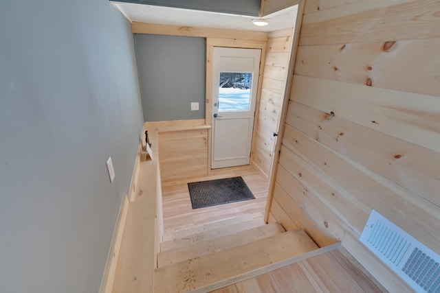 doorway with visible vents and wood finished floors