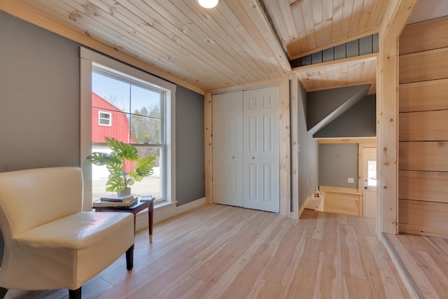 unfurnished room featuring wood ceiling and light wood finished floors