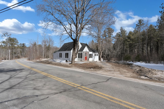 view of front of property with roof with shingles