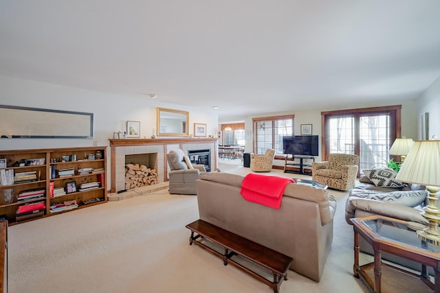 carpeted living area featuring a fireplace