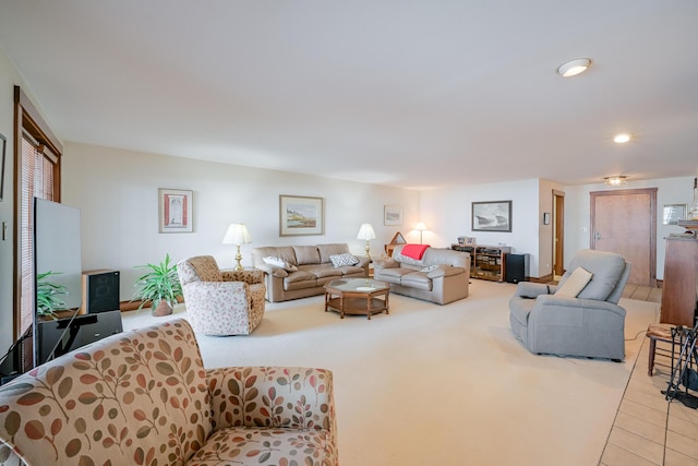 living area with tile patterned floors and recessed lighting