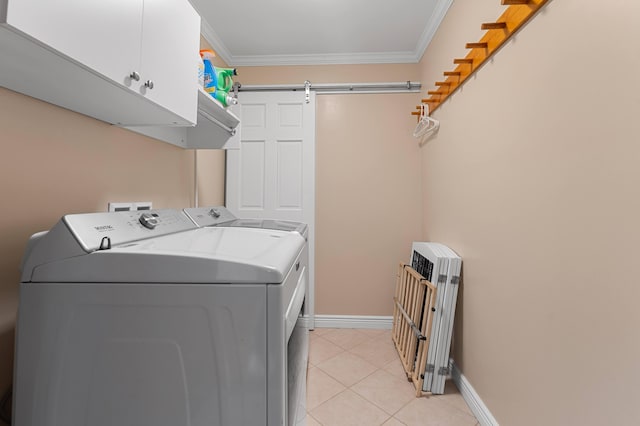 laundry room with crown molding, radiator, a barn door, and washer and clothes dryer