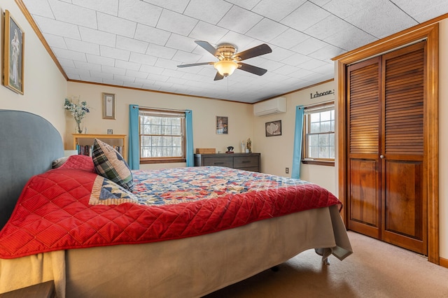 bedroom with crown molding, multiple windows, carpet, and a wall mounted AC