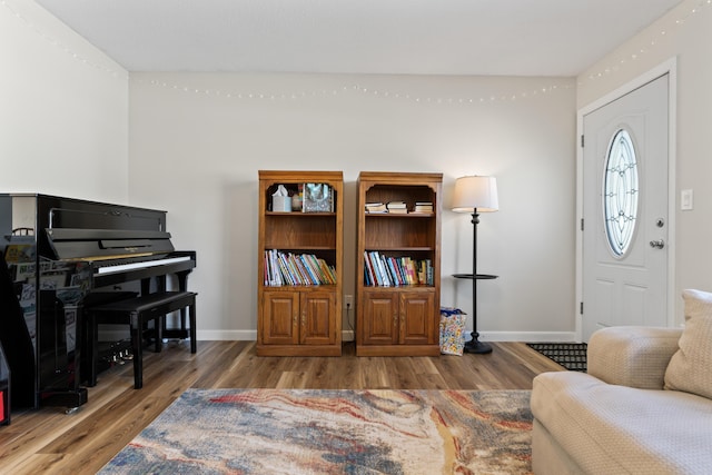 sitting room with wood finished floors and baseboards