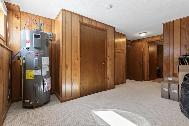 utility room featuring hybrid water heater