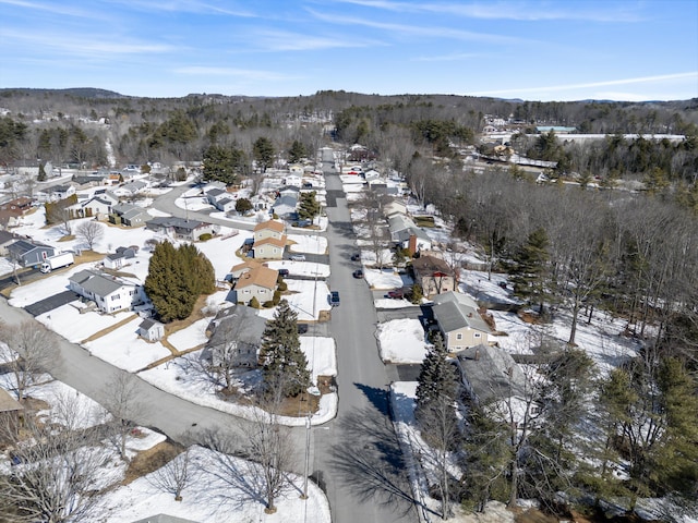 snowy aerial view featuring a residential view