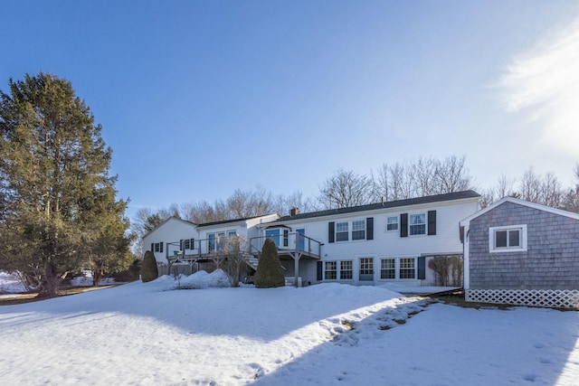 view of front of home featuring an outdoor structure and a deck