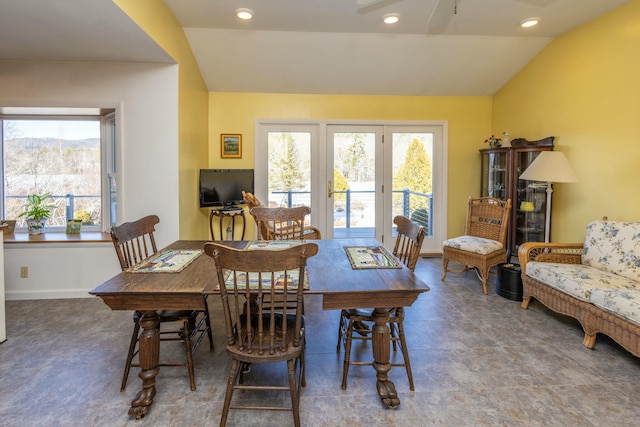 dining space featuring vaulted ceiling, recessed lighting, and baseboards