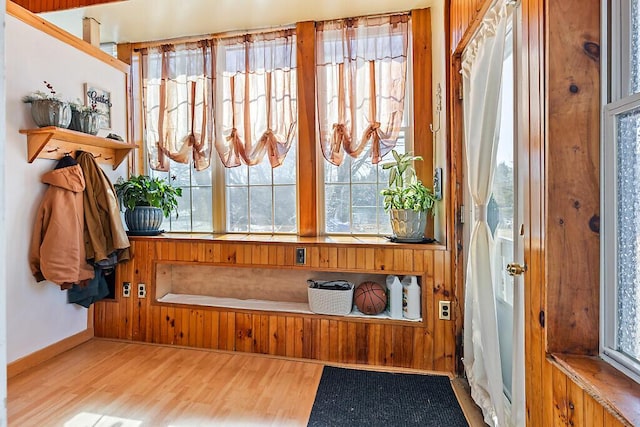 interior space featuring baseboards and wood finished floors