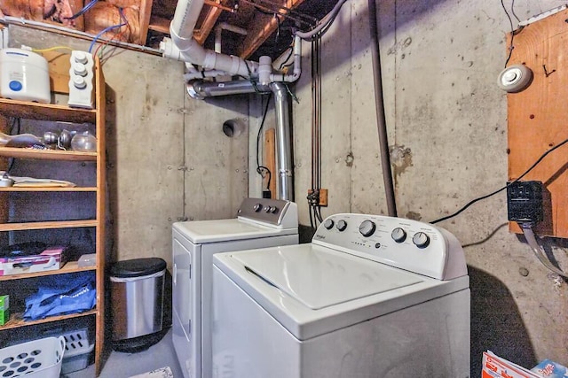clothes washing area with laundry area and washer and clothes dryer