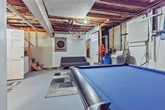 rec room featuring finished concrete flooring, pool table, and washer / dryer