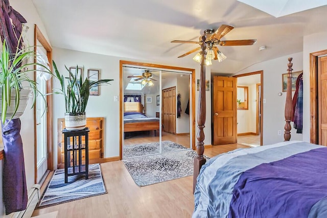bedroom featuring a closet, ceiling fan, baseboards, and light wood-type flooring
