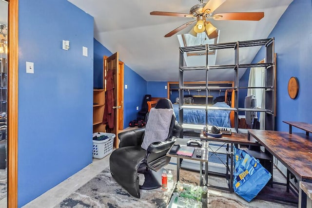 bedroom with a ceiling fan and concrete flooring