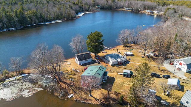 aerial view with a water view and a forest view