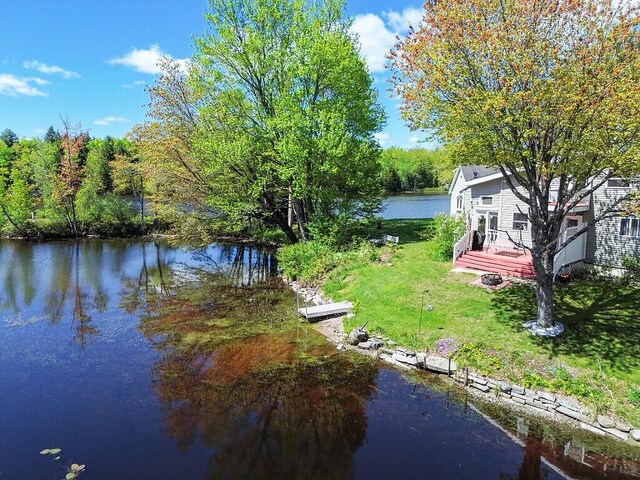 12 Town Line Rd, Belgrade, ME 04917 - dock area featuring a yard and a deck with water view
